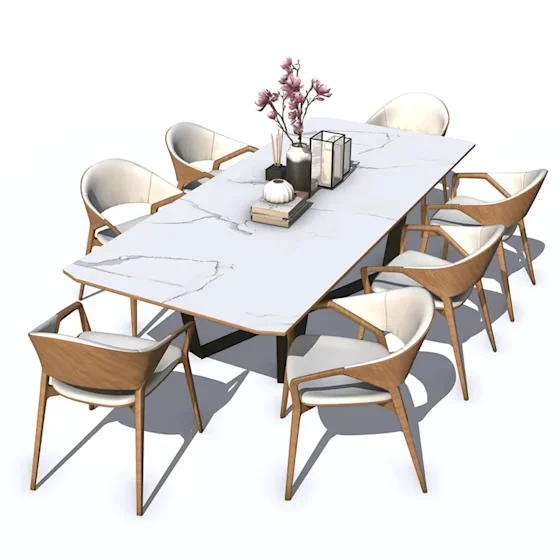 White marble dining table with flowers and surrounding wooden chairs